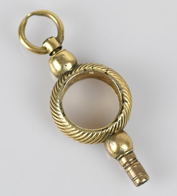 Lot 31 - A 19th century yellow metal pocket watch key,...