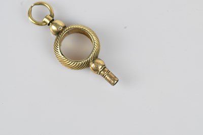 Lot 31 - A 19th century yellow metal pocket watch key,...