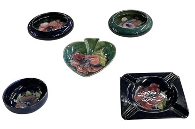 Lot 580 - MOORCROFT; five assorted art pottery dishes...