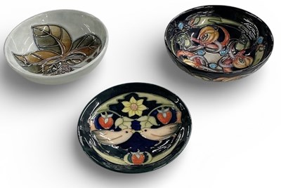 Lot 603 - MOORCROFT; an art pottery 'Strawberry Thief'...
