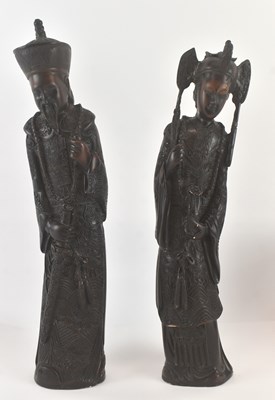 Lot 542 - A pair of modern Chinese carved resin figures...
