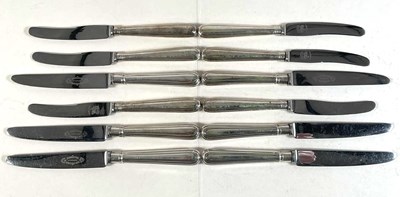 Lot 580 - A set of six George V silver sheath handled...