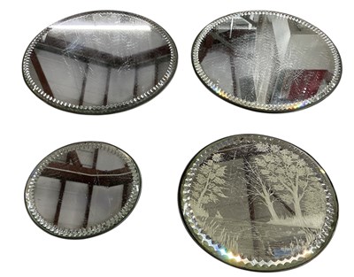 Lot 658 - A pair of early 20th century circular mirrored...