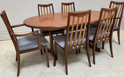 Lot 1065 - A mid century teak dining table, height 71cm,...