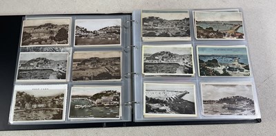 Lot 442 - A postcard album comprising approximately four...