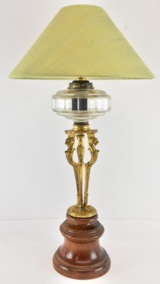 Lot 101 - A late 19th century ormolu gilt metal oil lamp,...