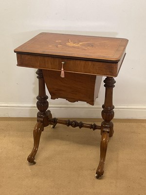 Lot 642 - A Victorian burr walnut sewing table with...