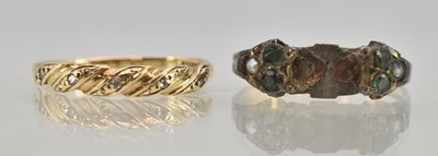 Lot 1267 - A 9ct yellow gold diamond set twist ring, set...
