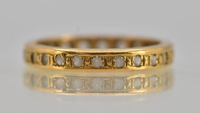 Lot 1245 - An 18ct yellow gold white stone full eternity...