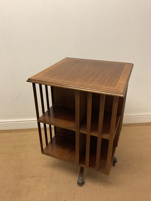 Lot 667 - A reproduction mahogany revolving bookcase,...