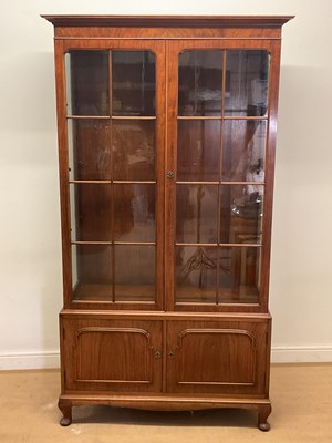 Lot 633 - An early to mid 20th century walnut display...