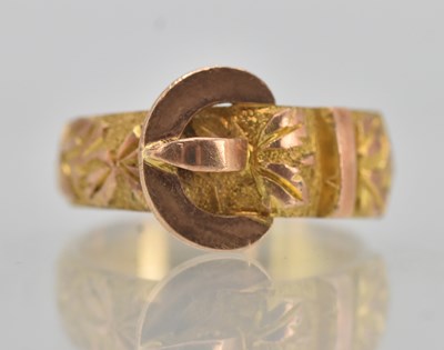 Lot 1271 - A 9ct rose gold buckle ring with floral...