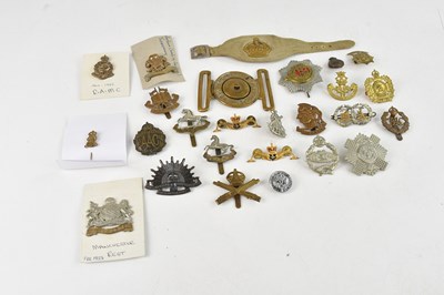Lot 551 - A collection of assorted military cap badges...