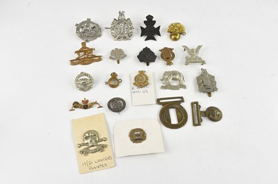 Lot 552 - A collection of assorted cap badges, buttons...