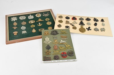 Lot 561 - Three montages of assorted cap badges, various...