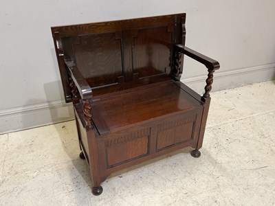 Lot 1109 - A reproduction oak monk's bench, height 76cm,...