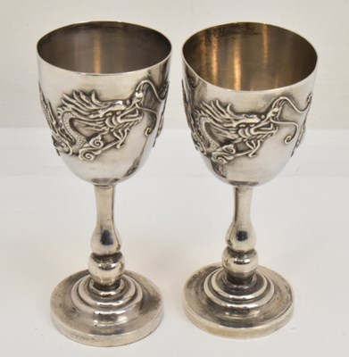 Lot 1100 - Two Chinese silver small wine glasses, both...