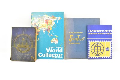Lot 532 - Four schoolboy style stamp albums containing...