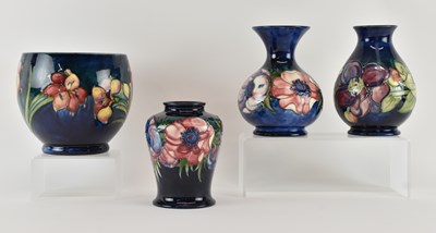 Lot 565 - WILLIAM MOORCROFT; four pieces of 'Anemone'...