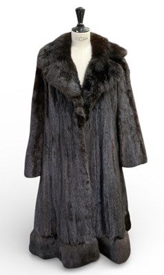 Lot 486 - An early 20th century mink fur coat, with...