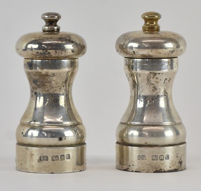 Lot 1102 - DOUGLAS PELL SILVERWARE; an associated pair of...