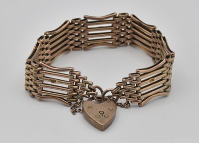 Lot 1446 - A 9ct yellow gold gate link bracelet with...