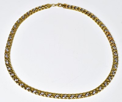 Lot 812 - An 18ct yellow and white gold braid-effect...