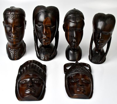 Lot 218 - Four carved African hardwood busts, comprising...