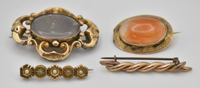 Lot 1161 - Four items of yellow metal jewellery,...