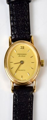 Lot 893 - RECORD; a 9ct yellow gold ladies' quartz...
