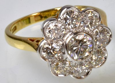 Lot 764 - An 18ct yellow gold floral cluster ring set...