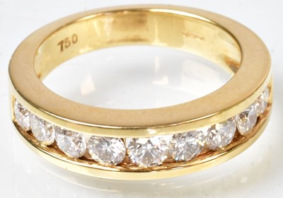 Lot 769 - An 18ct yellow gold half eternity ring set...