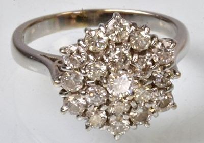 Lot 768 - An 18ct white gold cluster ring set with...