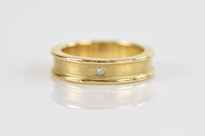 Lot 604 - A yellow brushed metal diamond set wedding...