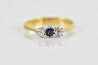 Lot 607 - An 18ct yellow gold diamond and sapphire three...