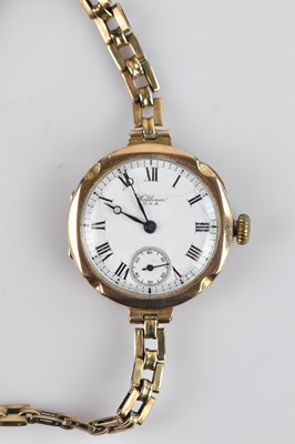 Lot 1073 - A 9ct gold cased wristwatch, the dial set with...