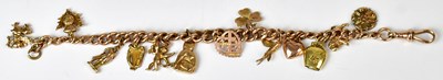 Lot 800 - A 9ct yellow gold charm bracelet suspending...