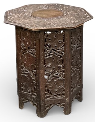 Lot 64 - An Anglo-Indian profusely carved octagonal top...