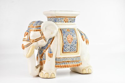 Lot 1443 - A ceramic jardinere stand modelled as an...