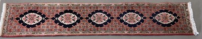 Lot 1156 - A red ground Persian style hand knotted wool...