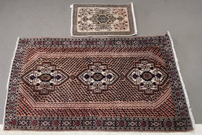 Lot 2169 - A brown ground Persian hand knotted wool rug,...