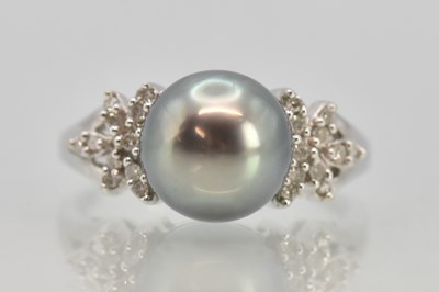 Lot 1208 - An 18ct white gold diamond and Tahitian black...