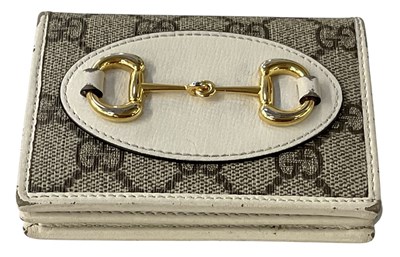 Lot 485 - GUCCI; a white leather and GG monogram canvas '...