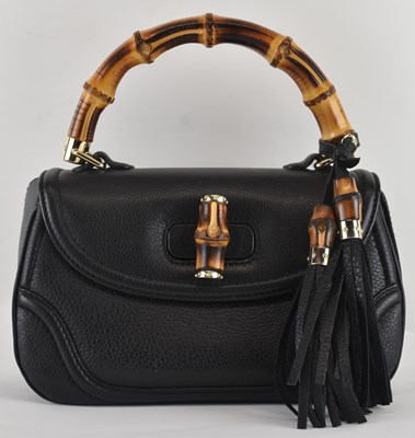 Lot 457 - GUCCI; a lady's black leather 1947 'Mini' bag,...