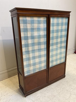 Lot 1189 - An Edwardian mahogany bookcase with two glazed...