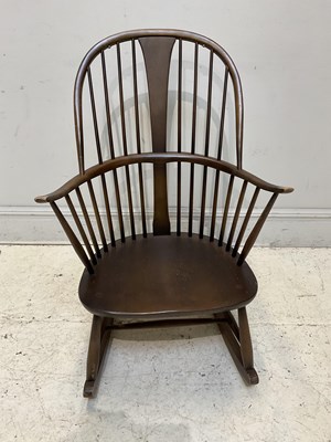 Lot 1201 - An Ercol style elm rocking chair.