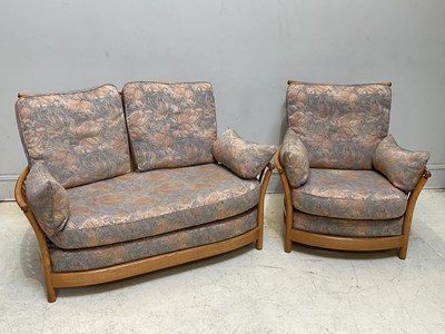 Lot 1028 - ERCOL; a three piece suite comprising a two...