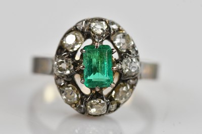 Lot 467 - A yellow metal diamond and emerald cluster...