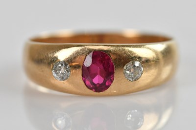 Lot 494 - A yellow metal diamond and ruby three stone...