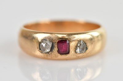 Lot 549 - A yellow metal diamond and ruby set rubover...